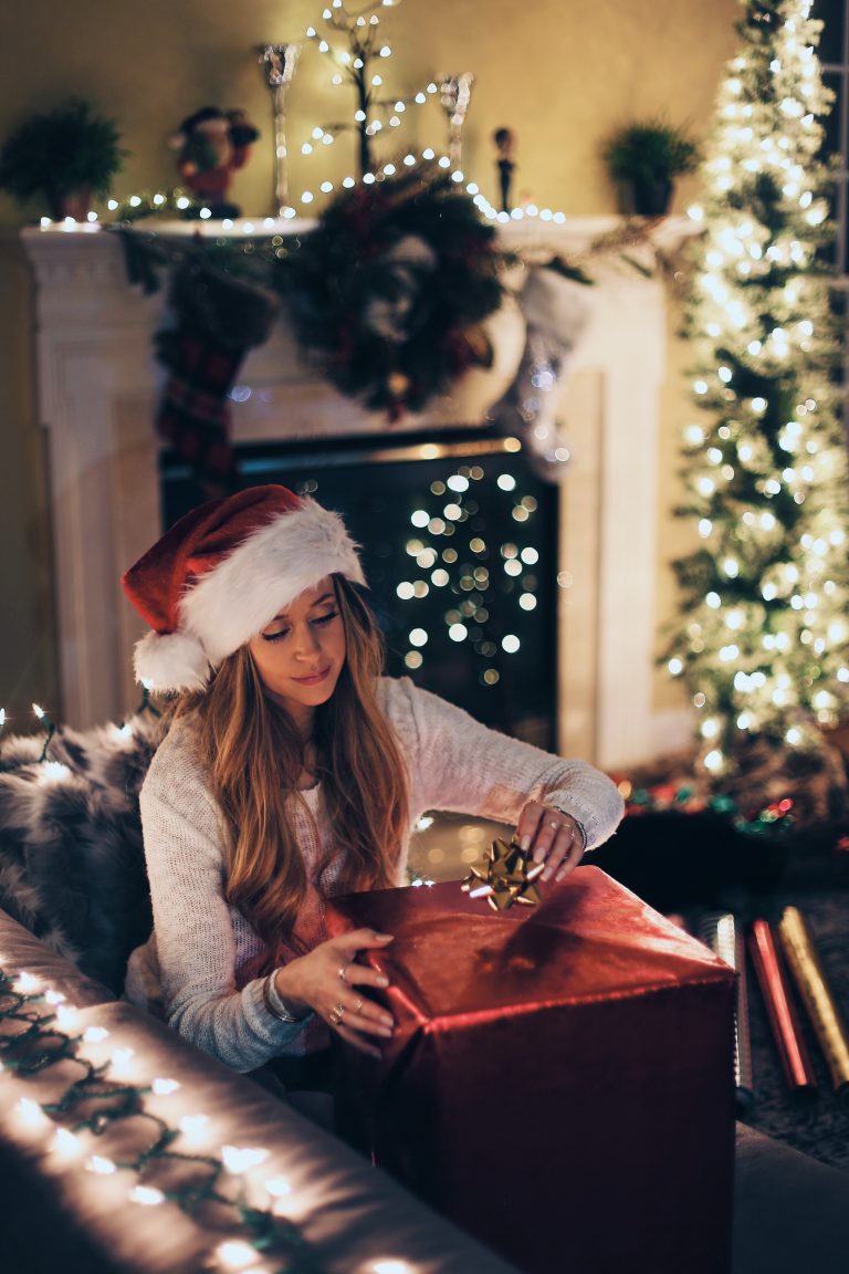 adding a bow to a xmas gift