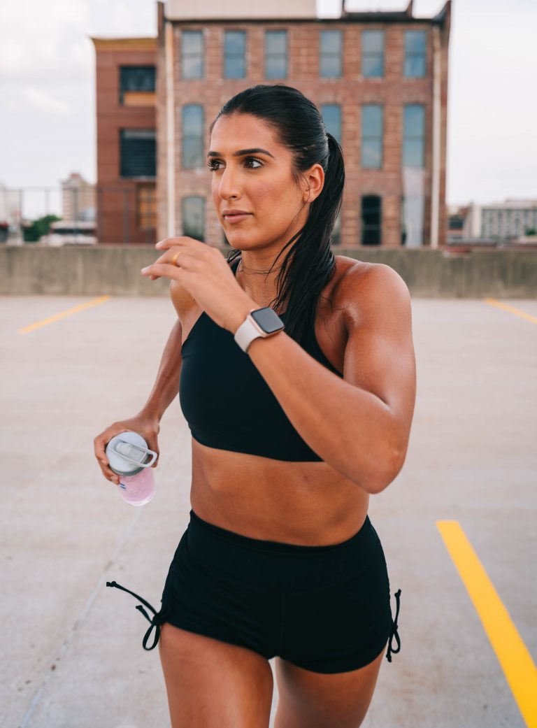woman running outside in shorts