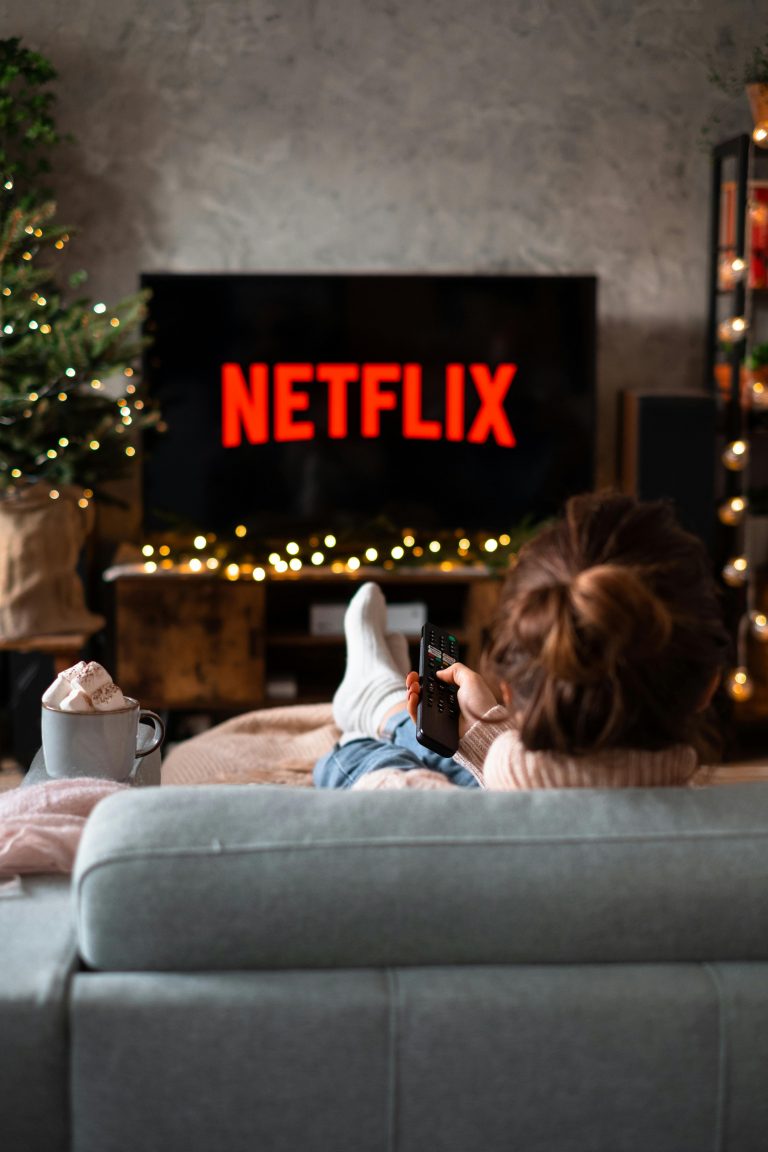 woman watching Netflix on the sofa
