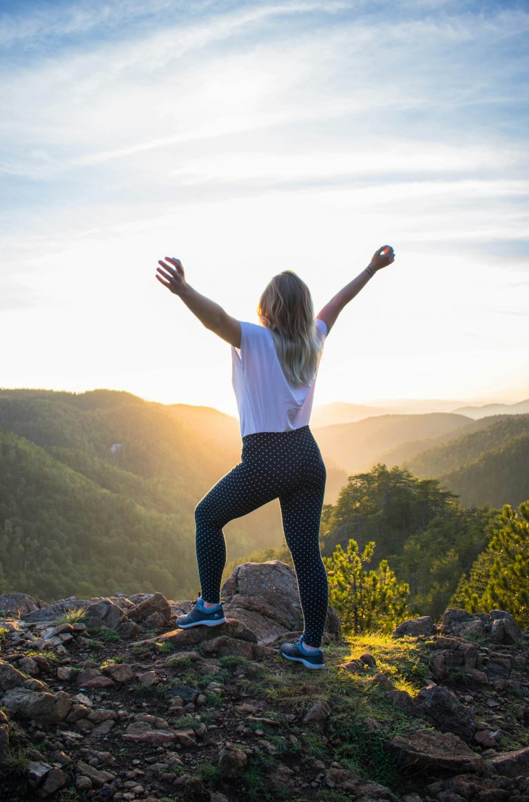 woman outdoors hiking in sunshine