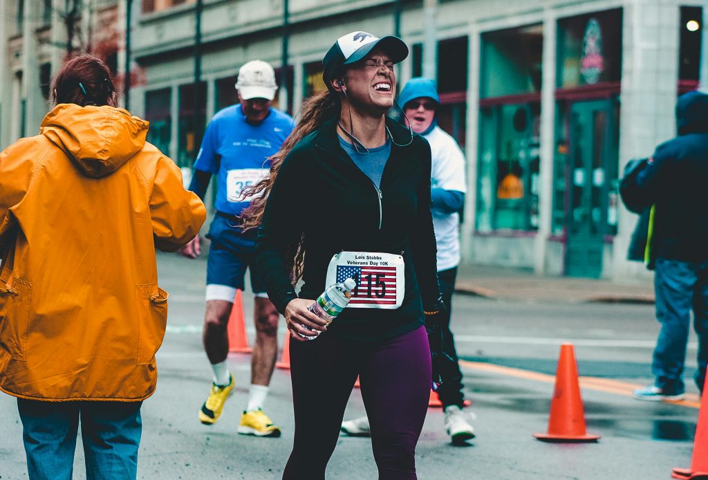 woman in pain on a marathon