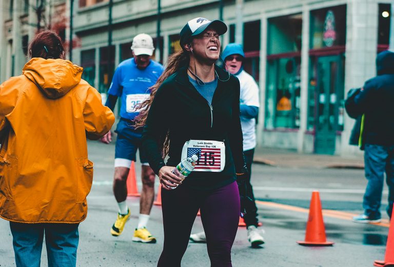 woman in pain on a marathon