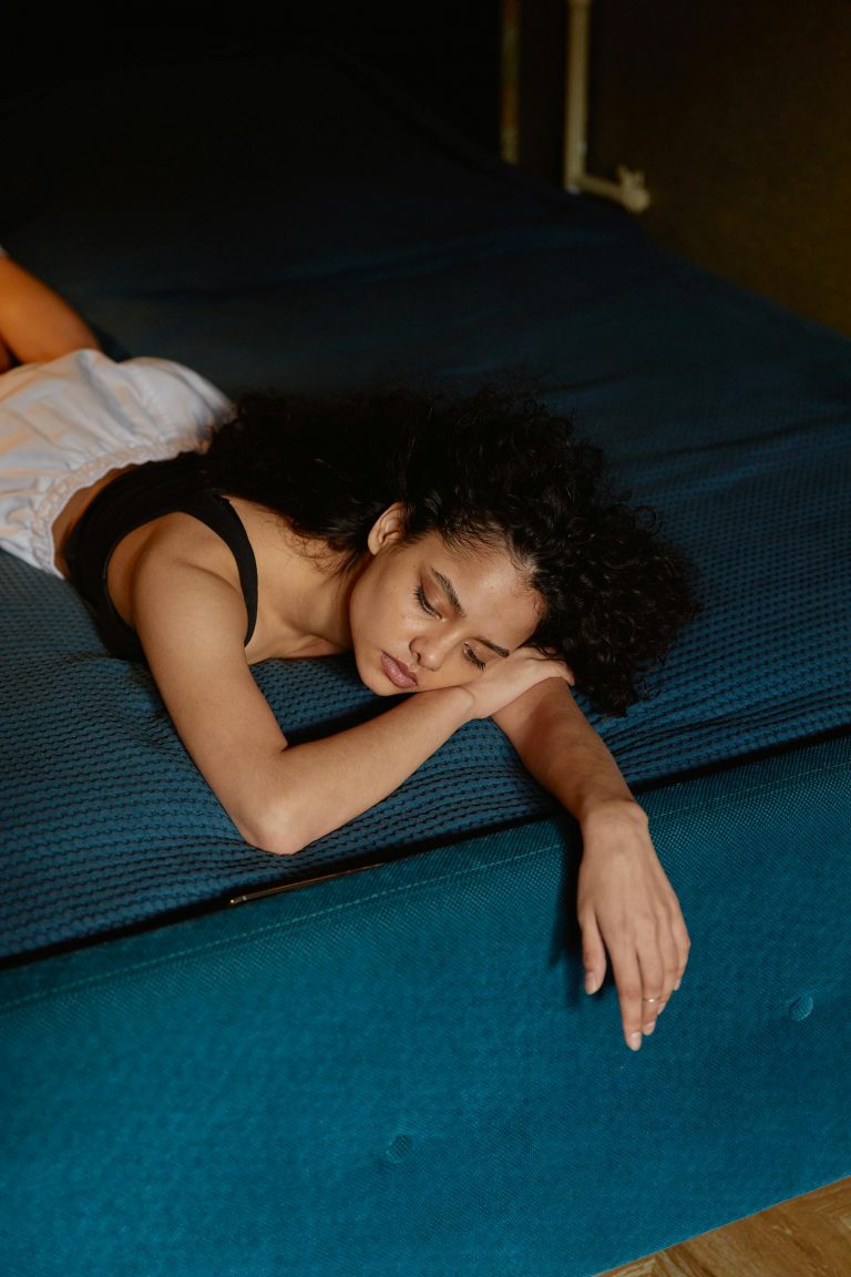 woman lying on sofa