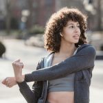 woman stretching before a run