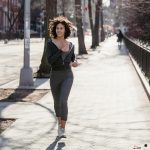 woman running outside in city