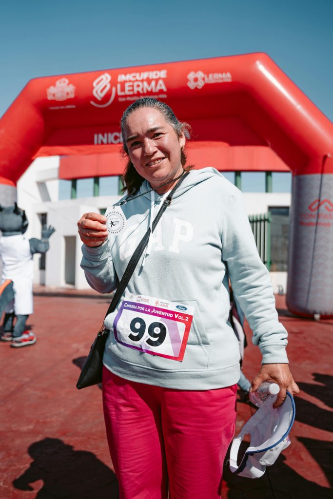 happy runner with a medal 