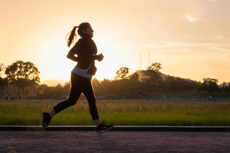 Female runner training for a 10K 
