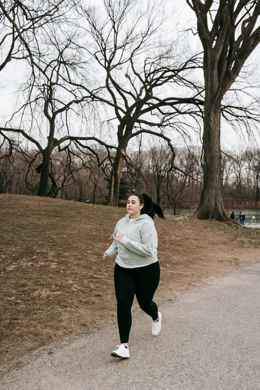 Beginner runner training for a 10K in the park